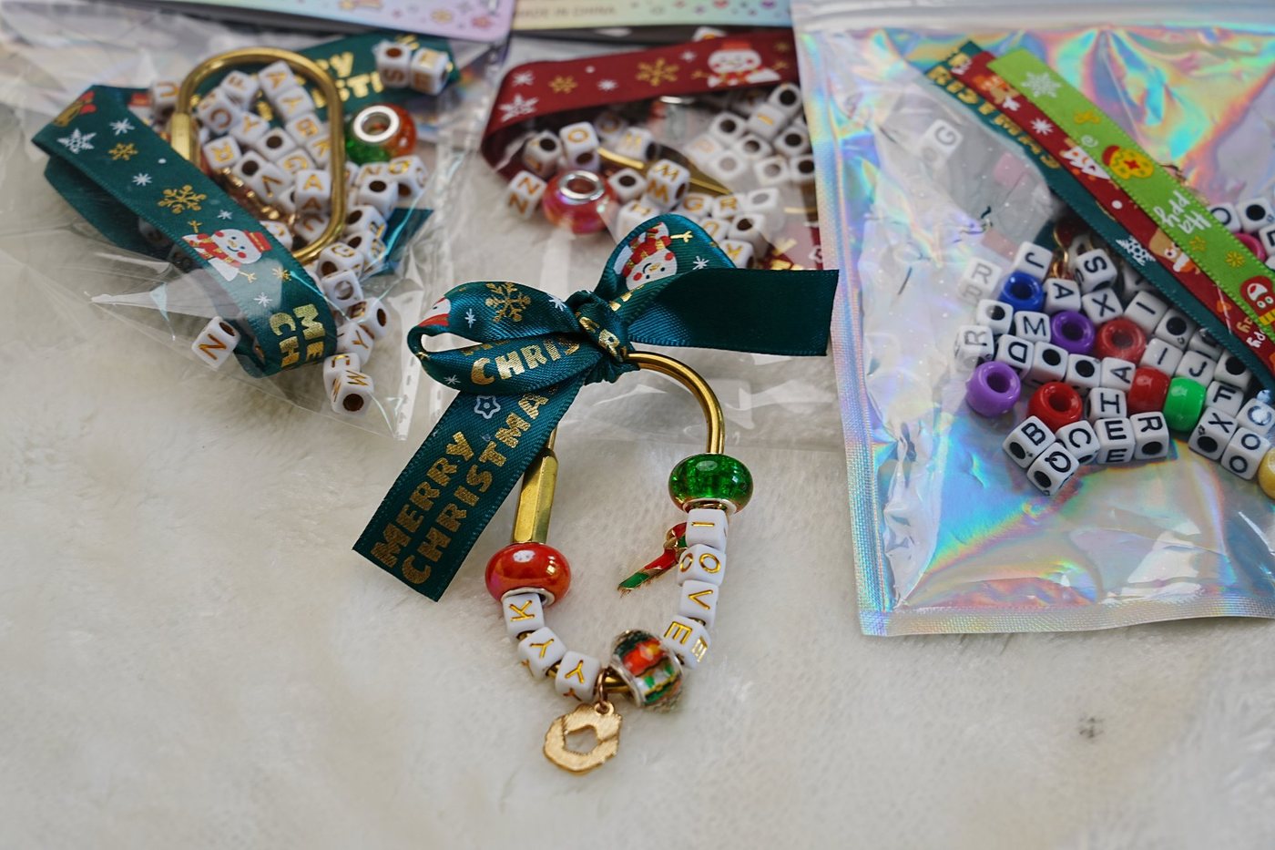 DIY Christmas charm kit with letter beads, gold carabiner and festive ribbon