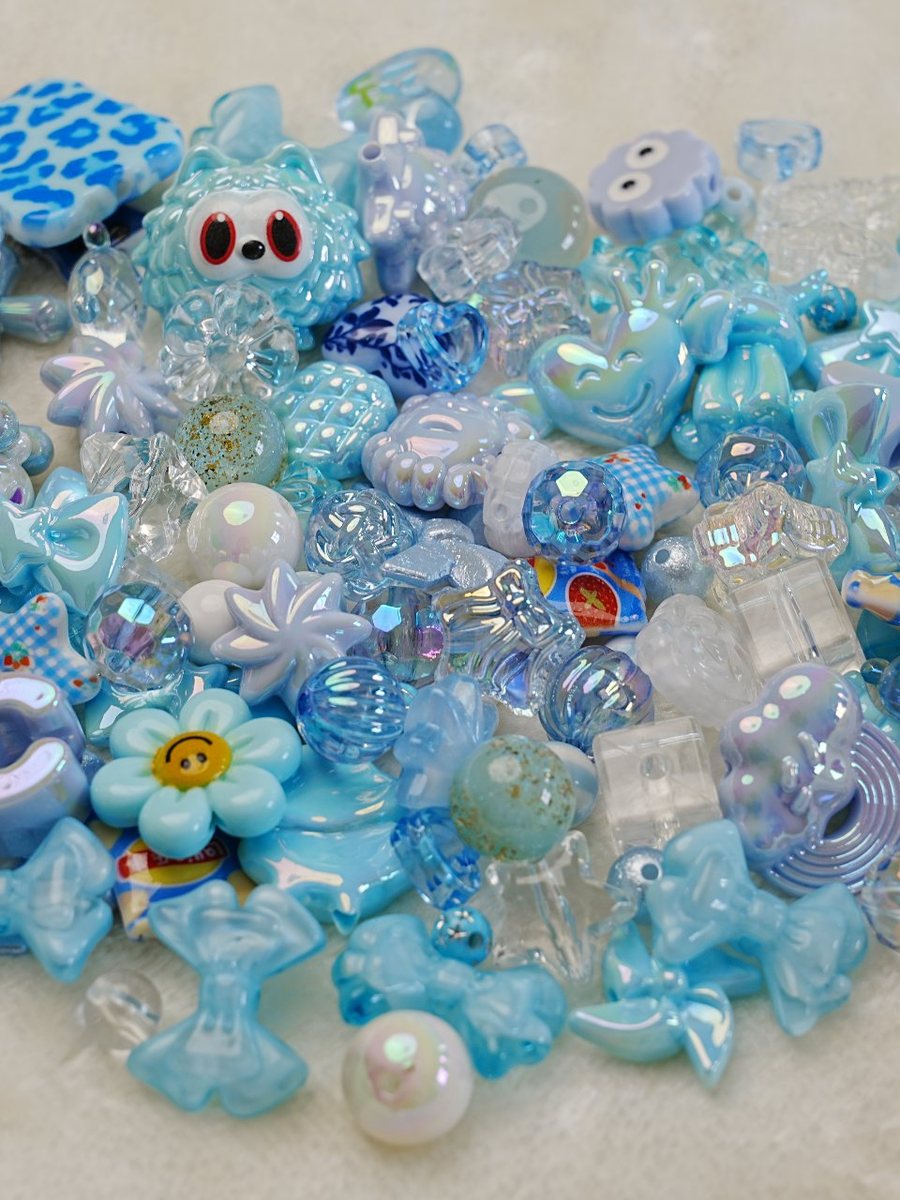 Sky blue bead mix with smiley flowers, bears and crystal beads