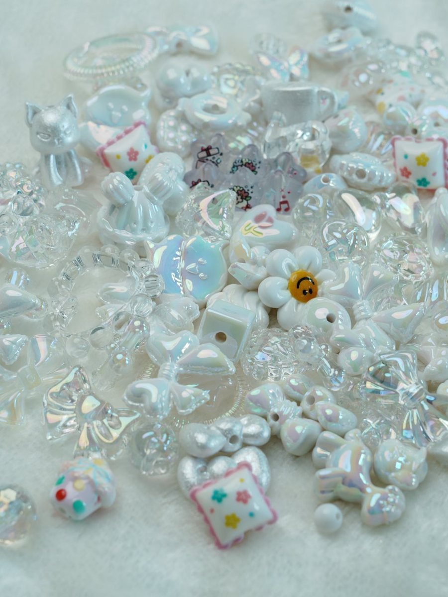 Pearl white bead mix with iridescent bows, hearts and flowers